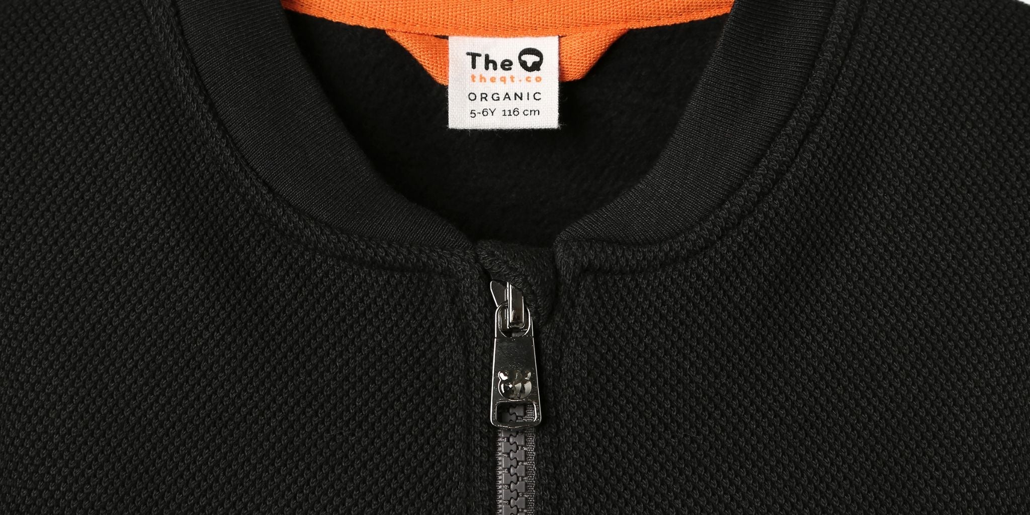 The Hidden Plastics in Clothing And Why The QT Chose a Different Path